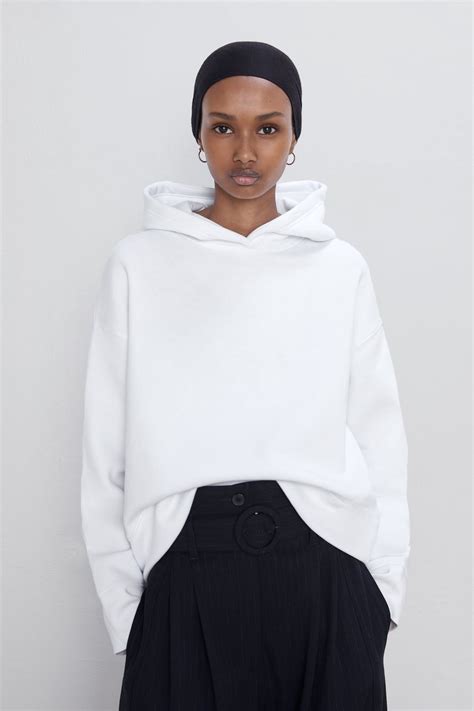 Zara sweatshirts - Warm and soft high quality interior. Mid-green | 4320/700. PAYMENTS AND INVOICES. ACCESSIBILITY DECLARATION. Long sleeve hooded sweatshirt. Rib trim. Printed text at chest. Warm and soft high quality interior.